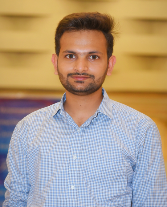 A person with a beardDescription automatically generated